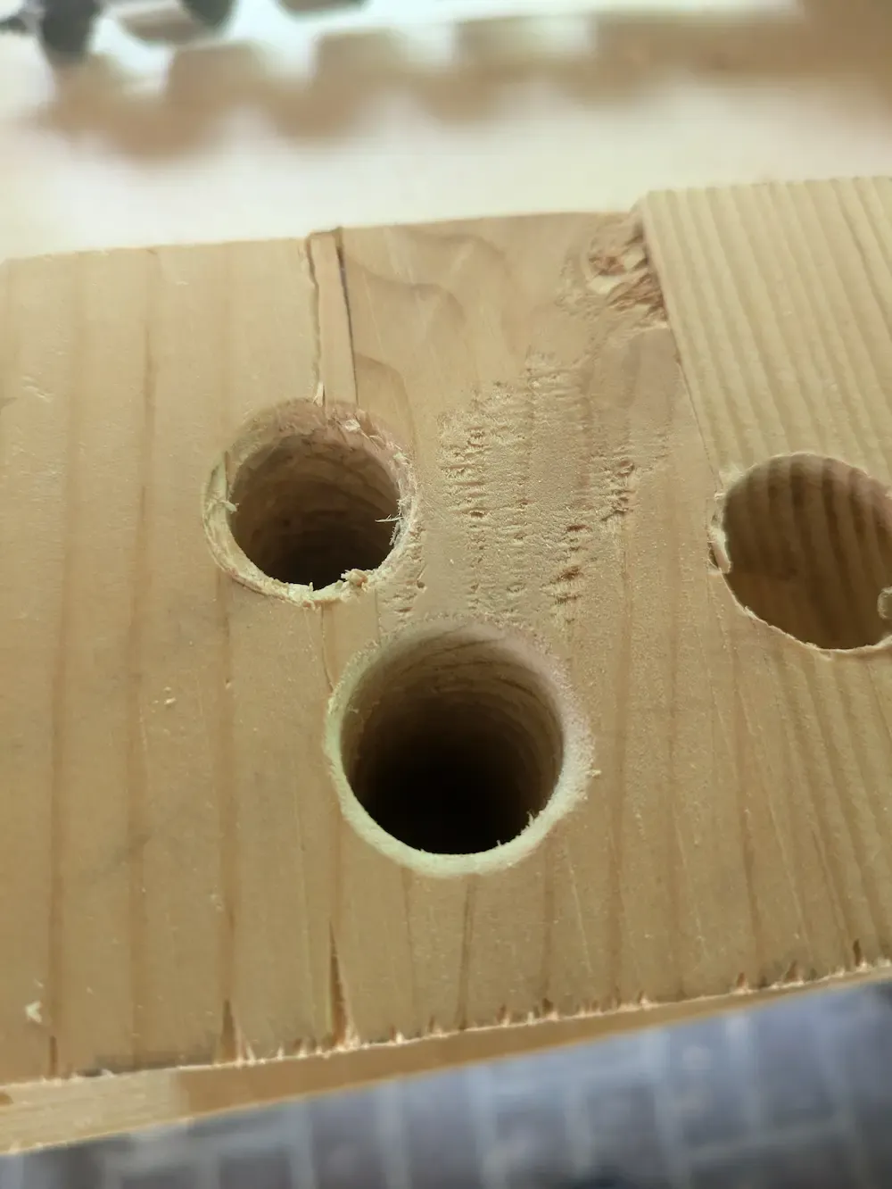 Close up of a few test holes showing some rough edges