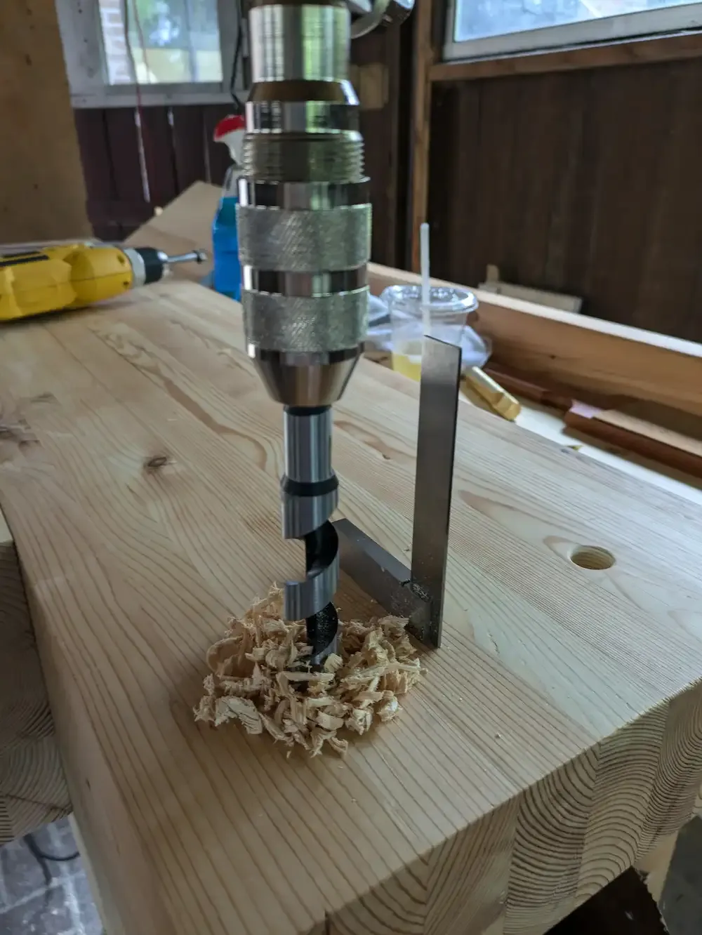 An auger bit referenced by a square