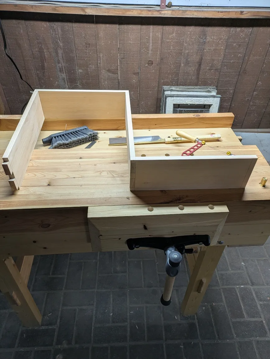 The fully assembled drawer sides but one of the sides fits in the wrong
way